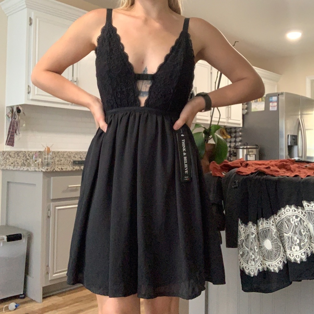 Low cut black dress with bow